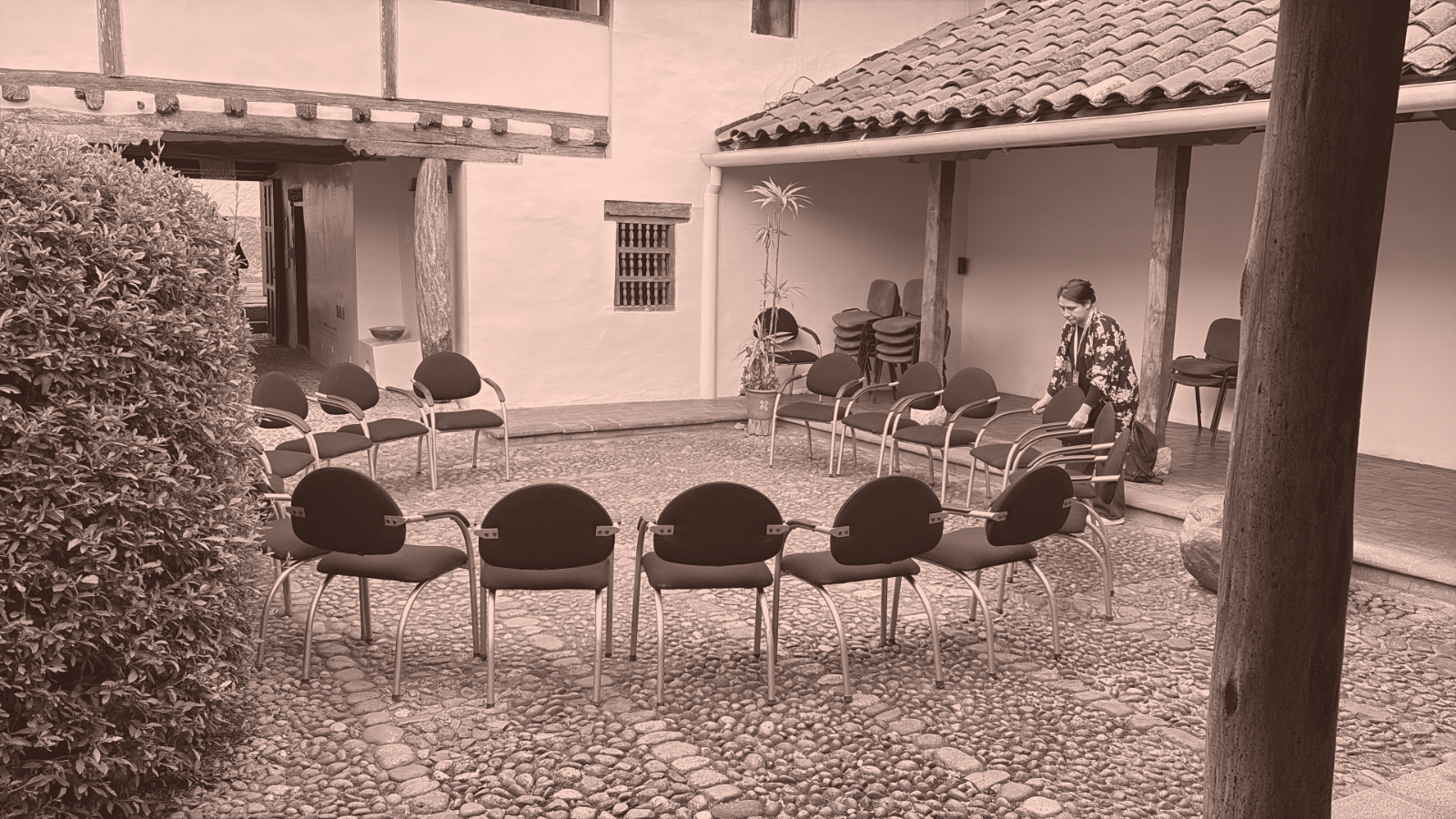 A circle of chairs in a colonial courtyard at the Bienal de Cuenca